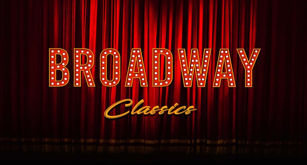 Broadway Classics in lights projected onto red stage drapes